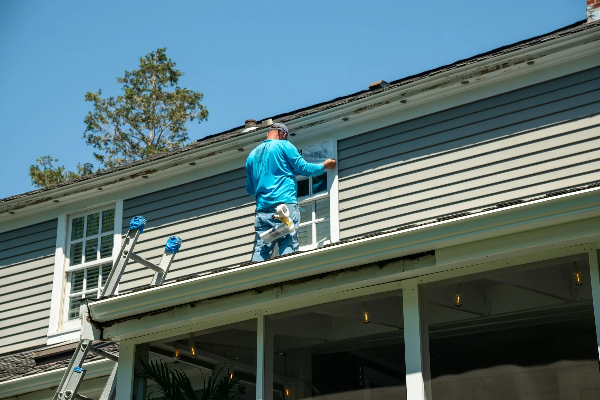 Window masked with plastic film before exterior painting