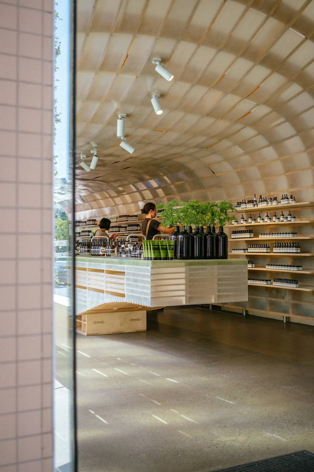 Bright retail interior with a curved wood ceiling