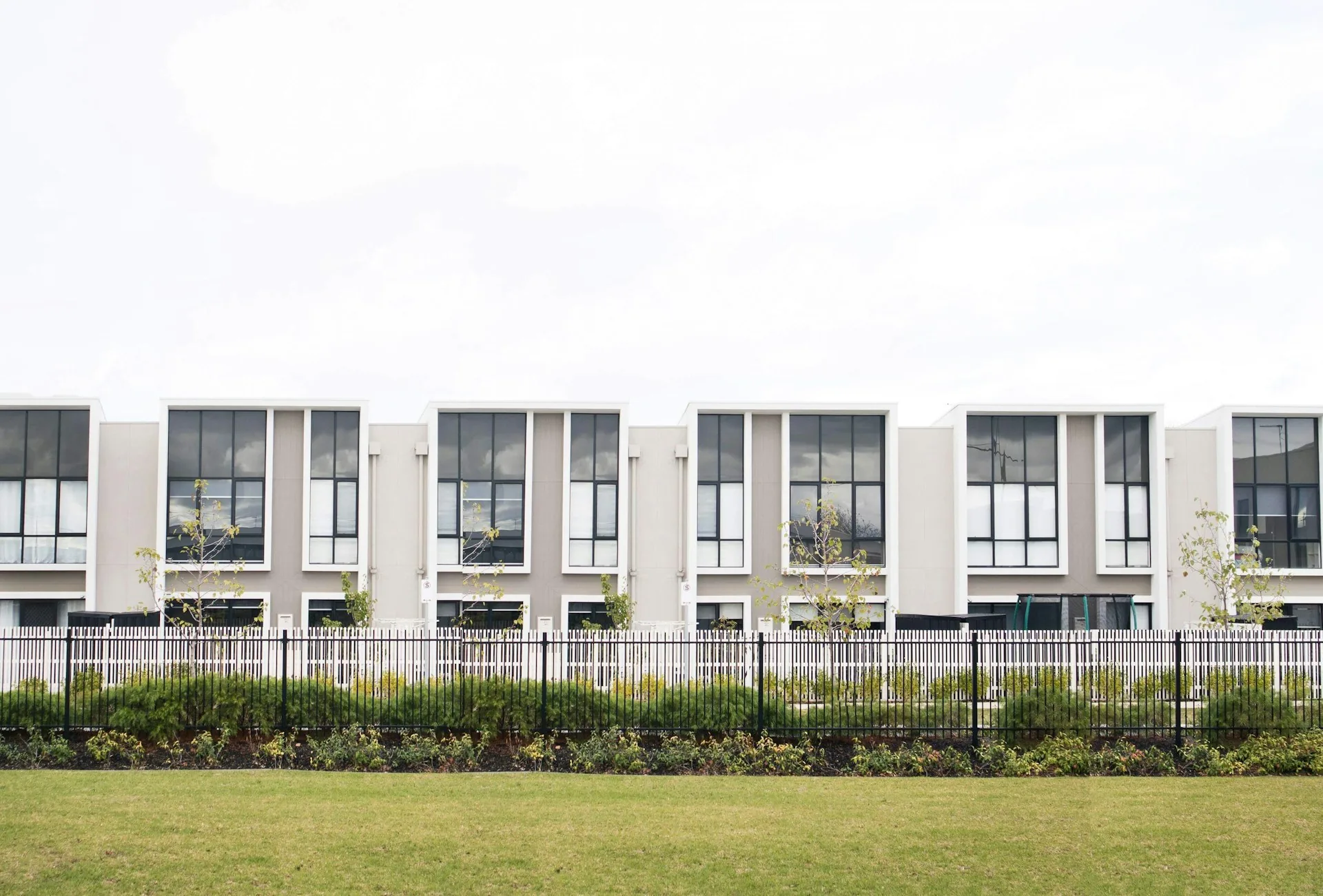 Row of new white townhomes